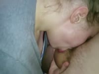 Lady deepthroating a huge dick and making it cum